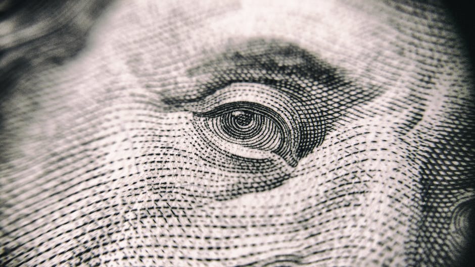 Close-up of Benjamin Franklin's eye on a $100.