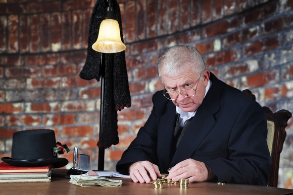 Scrooge-esque character counting coins