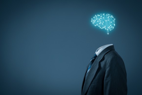 A blue brain, lit up, hovering above a man's business suit