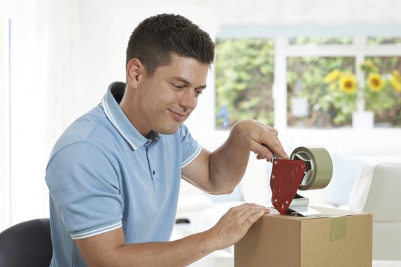 Man preparing box for return