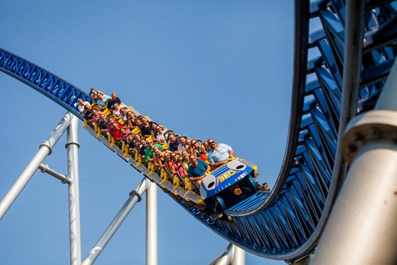 People riding a roller coaster