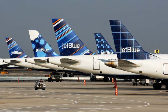 A row of JetBlue tailfins from its planes.