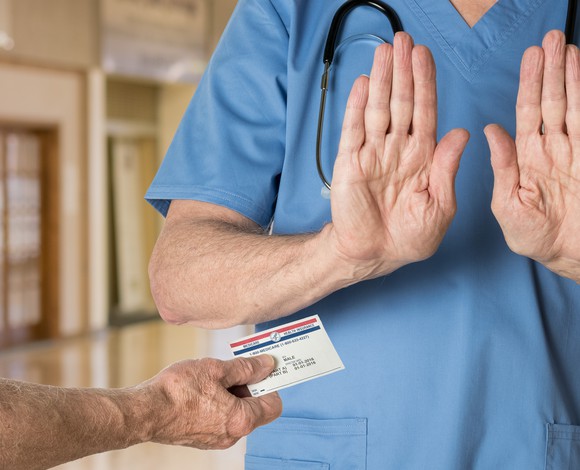 Doctor refusing to accept Medicare card.