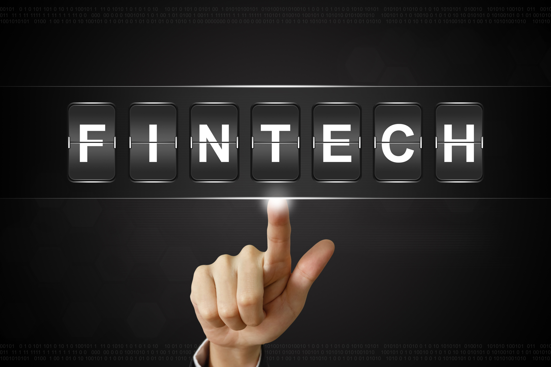 A person pointing to the word "FINTECH"