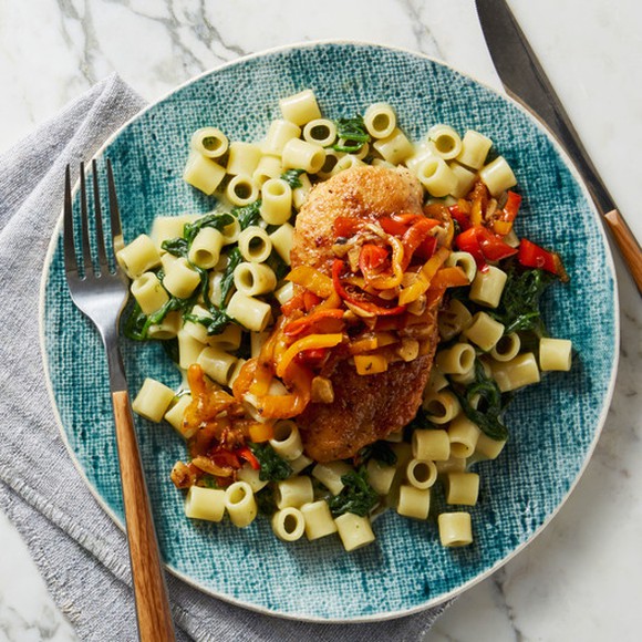 A plate of chicken and pasta