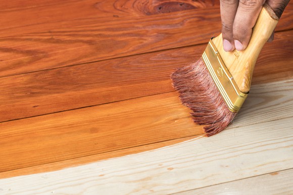 Wooden surface being stained