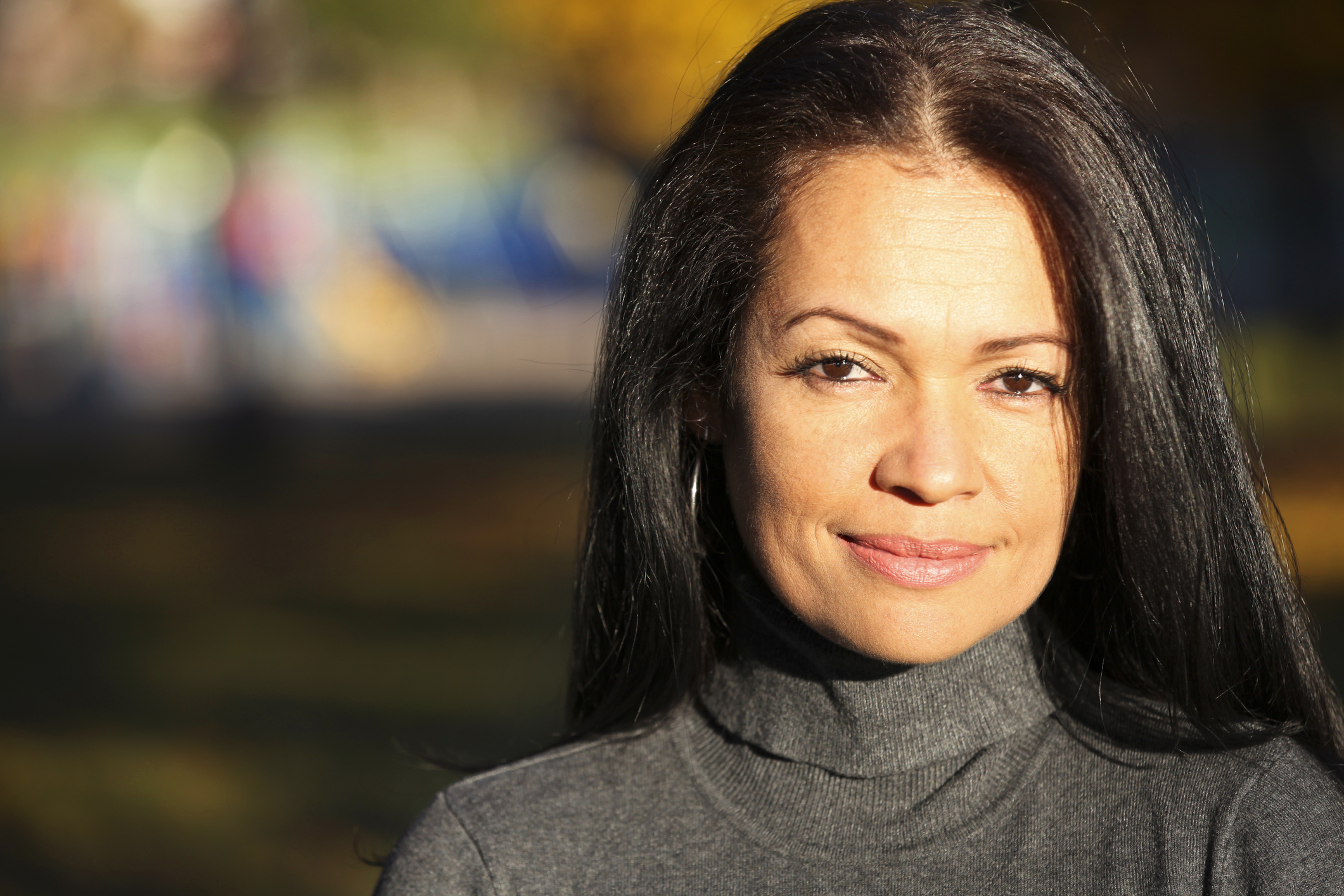 Serious woman with light smile
