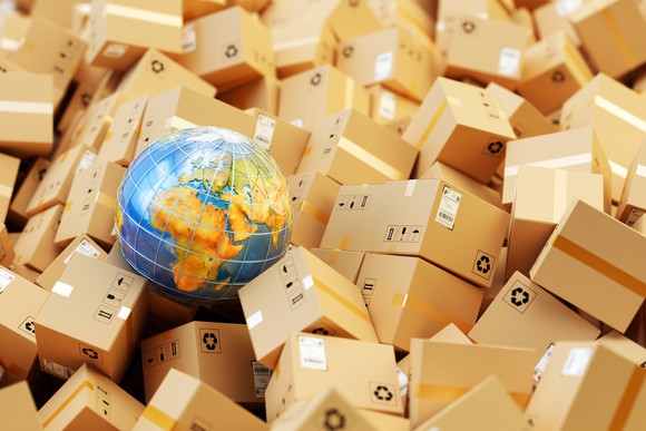 A globe in the middle of a big pile of packages