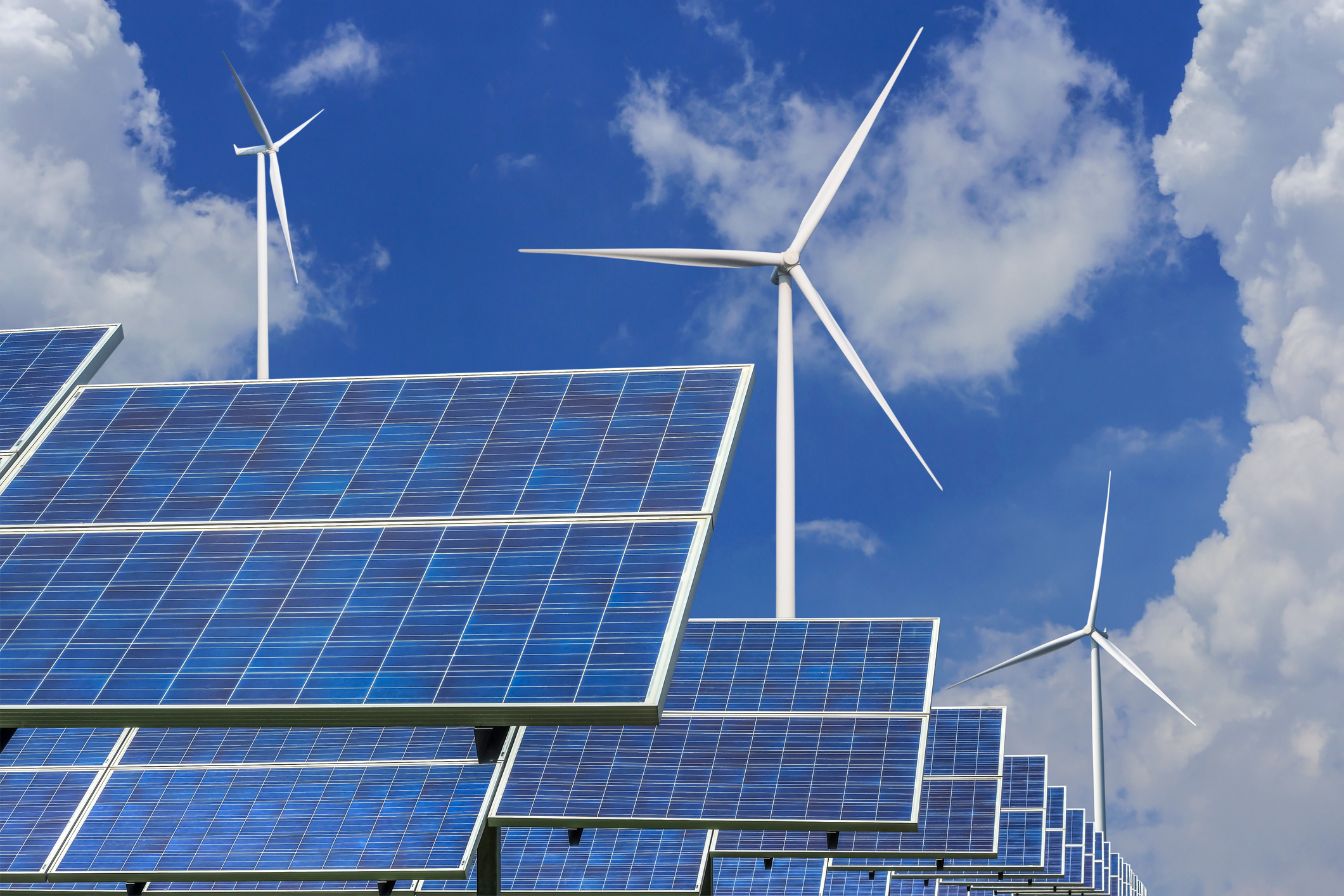 Several solar panels and wind turbines.