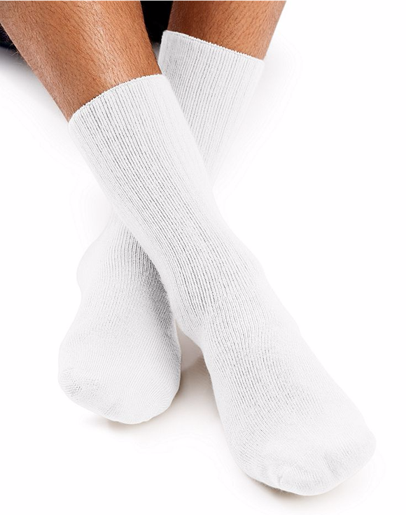 A mans feet wearing a pair of white Hanes stocks.