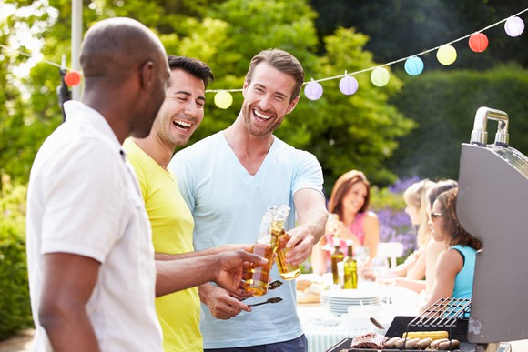 Friends drink beer at a party