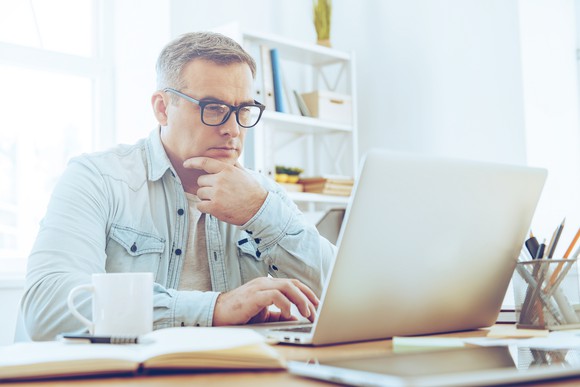 Man looking at laptop