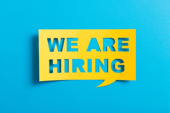 Sign reading "we are hiring"