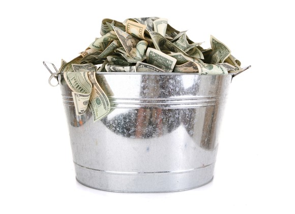 Metal bucket full of money