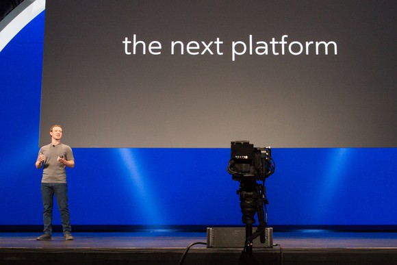 Mark Zuckerberg on stage with "the next platform" on a slide