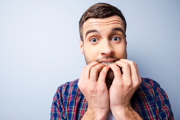 Man biting his nails