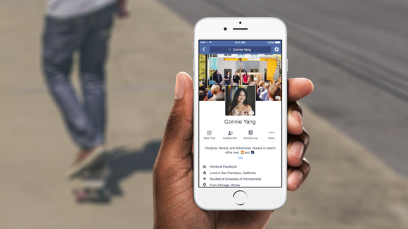 Person holding up a phone using the Facebook app