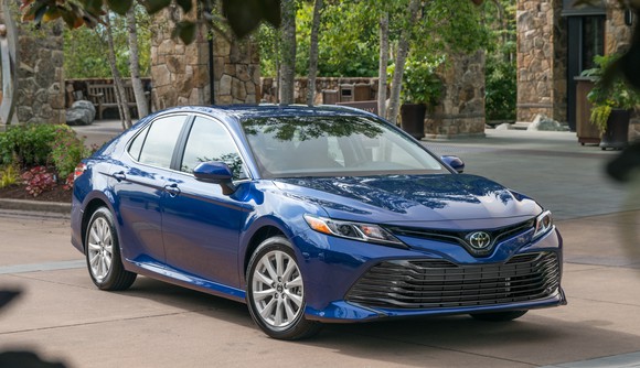 A blue 2018 Toyota Camry midsize sedan.