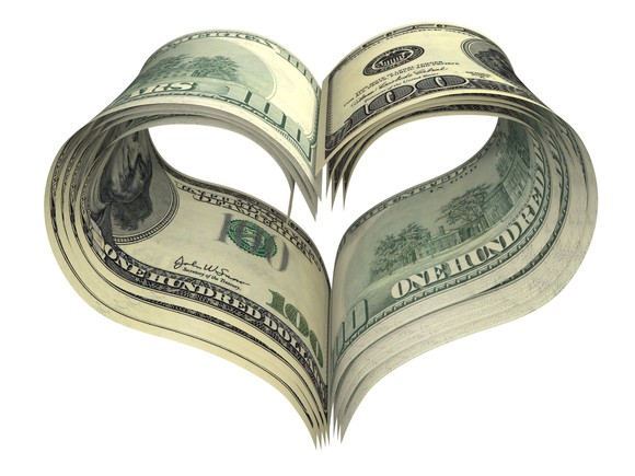 Stack of $100 bills shaped into a heart Stack of $100 bills shaped into a heart