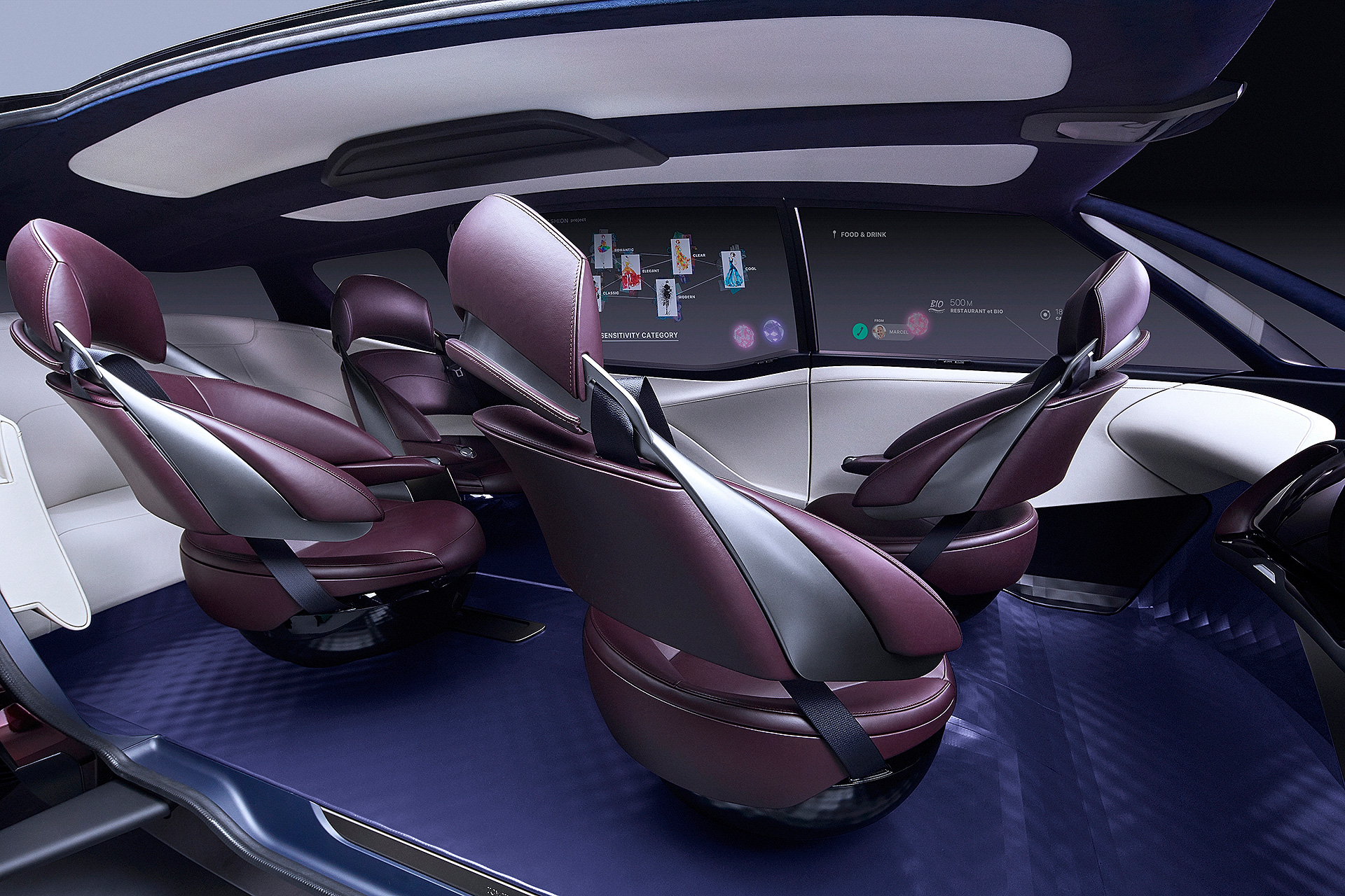 A view of the Fine-Comfort Vehicle's interior, showing its seats swiveled to face one another.