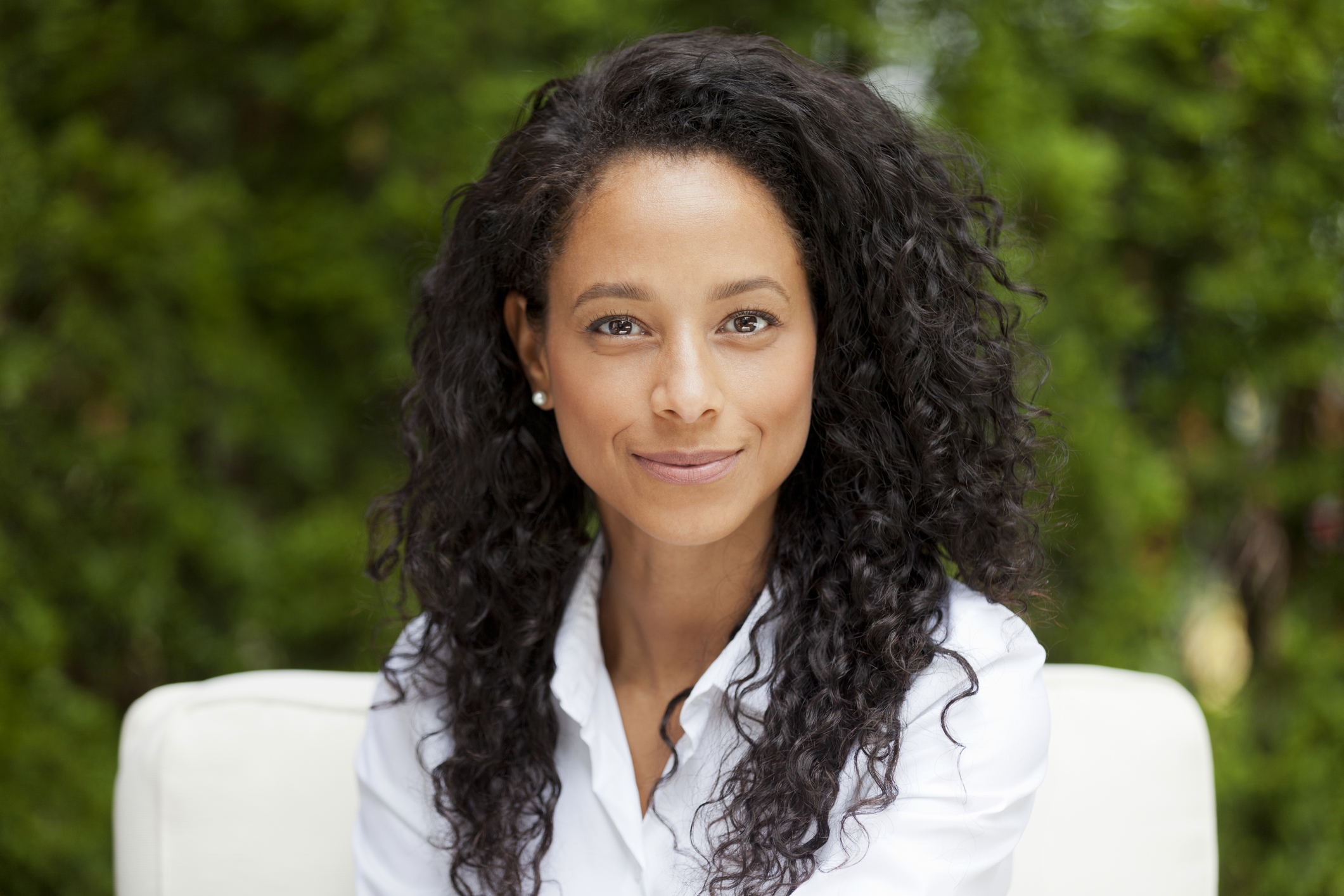 Smiling woman in collared shirt