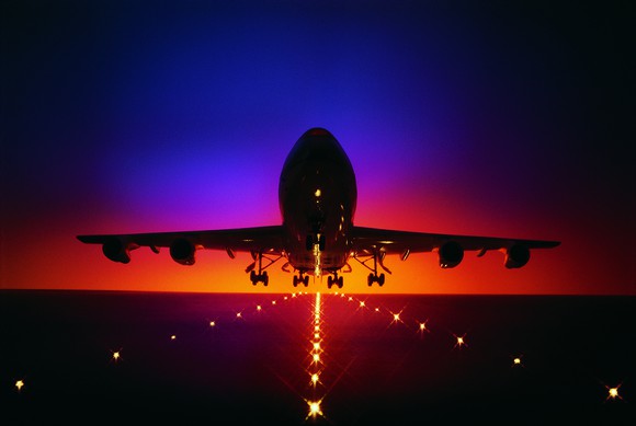 Plane taking off at dusk.
