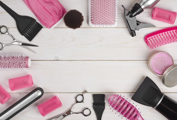 A selection of hair care and beauty products on a table.