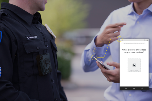 A uniformed officer, and a person in civilian dress, uploading content onto Evidence.com