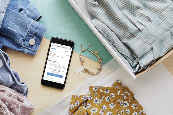 A mobile phone using Venmo Checkout to buy apparel.