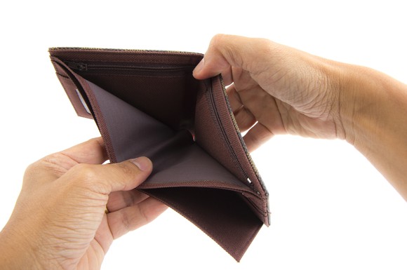 two hands holding open an empty wallet