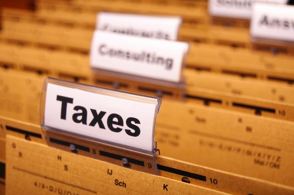 Close up of folders in a drawer, with the one in front labeled "Taxes"