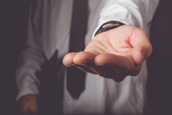 Man holding out his hand.