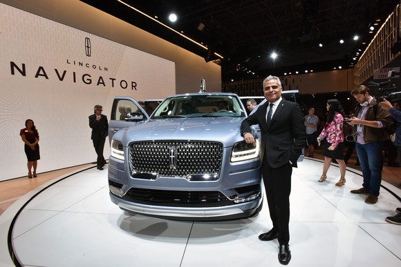 Galhotra is shown standing next to the all-new Lincoln Navigator on the Lincoln brand's show stand at the 2017 New York International Auto Show.