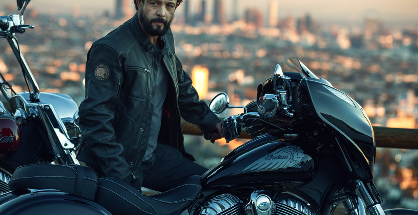 A man next to a Polaris Indian Chieftain