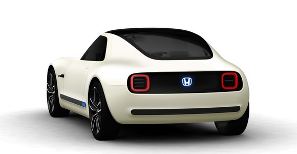 Honda's Sports EV Concept, a futuristic white coupe, shown from behind.