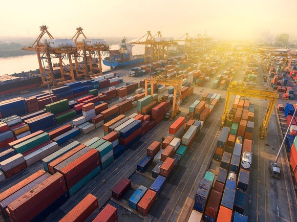 Shipping containers and cranes at a port.