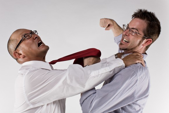 Two men attack each other. Two men attack each other.