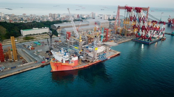 Ship loading oil platform in dockyard.