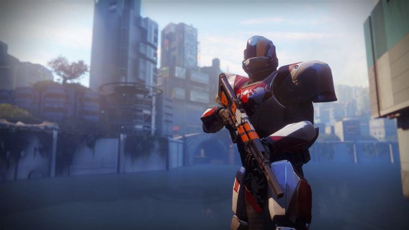 Screenshot of Activision Blizzard's Destiny video game depicting a robotic character holding a gun against a city backdrop.