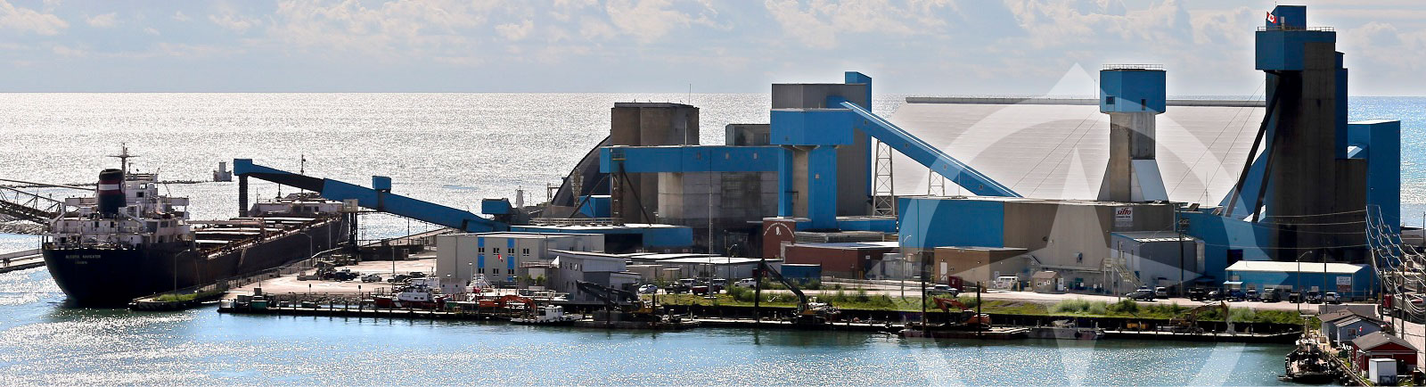 Compass Minerals salt plant on a coastline with cargo ships ready to pick up shipments.