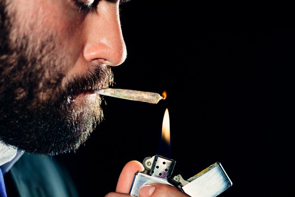 Man smoking marijuana joint