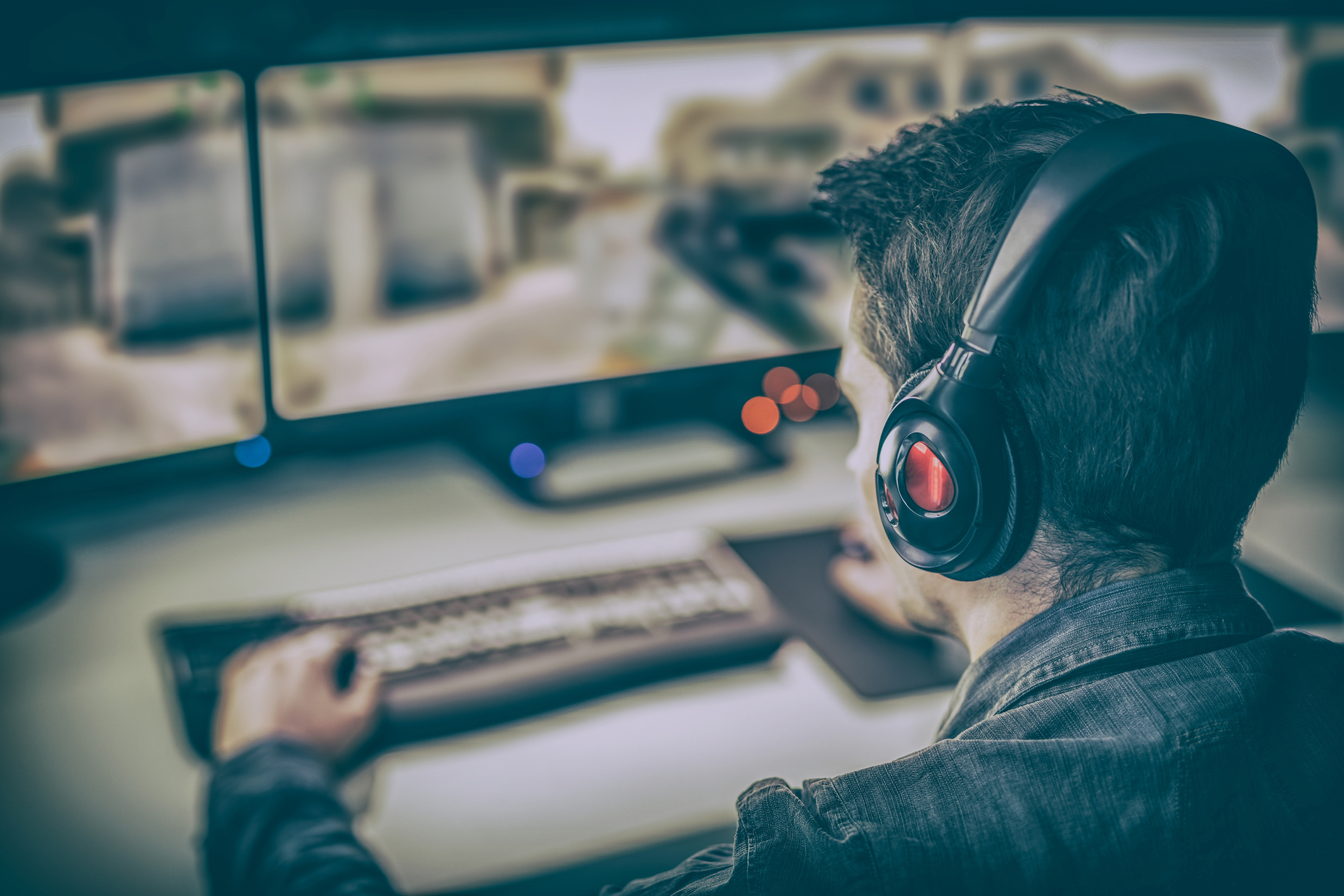 Man playing video games on a computer. 