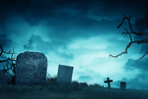 Gravestones in front of a stormy sky