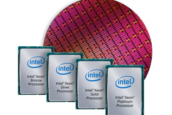 A wafer of Intel Xeon processors with finished, packaged processors in front of it.