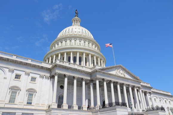 U.S. Capitol building from off-center below entry steps.