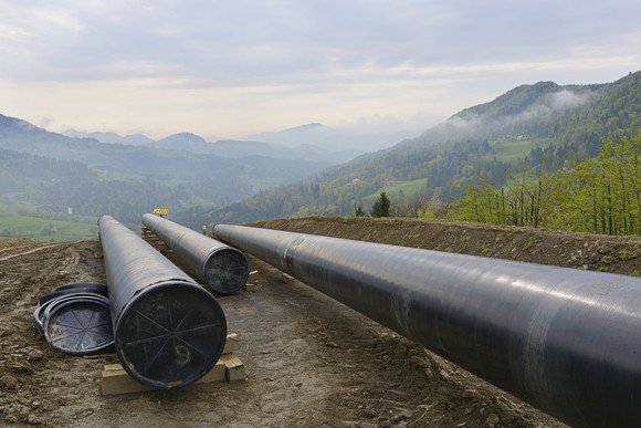 Pipeline segments waiting to be welded together.