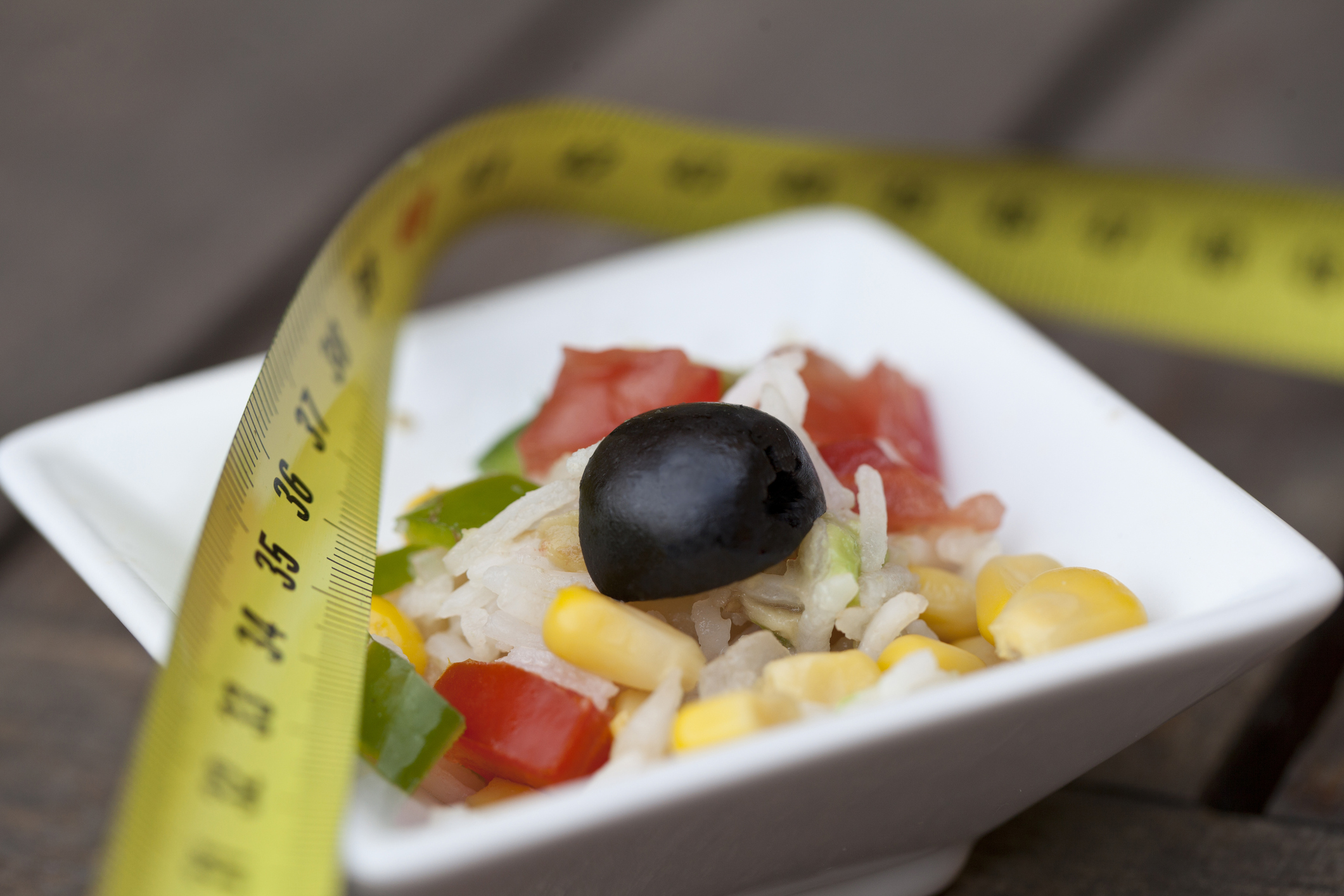 Bowl of food with a tape measure on top