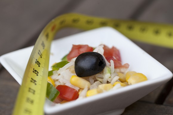 Bowl of food with a tape measure on top