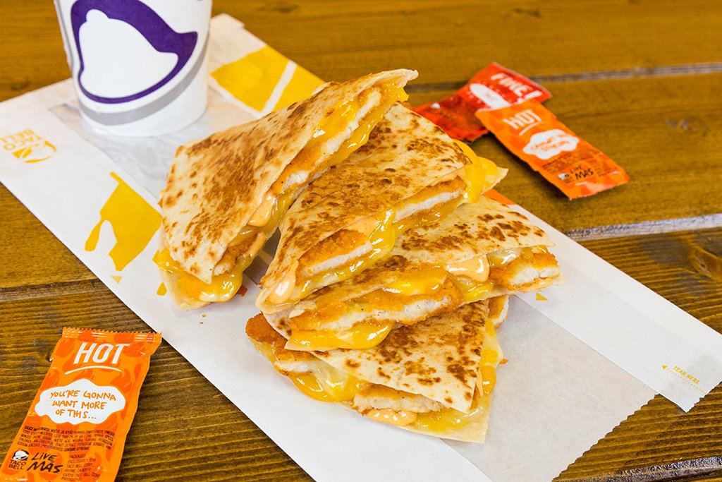 A chicken quesadilla piled up in quarters