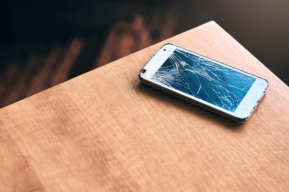 Broken smartphone on a table.